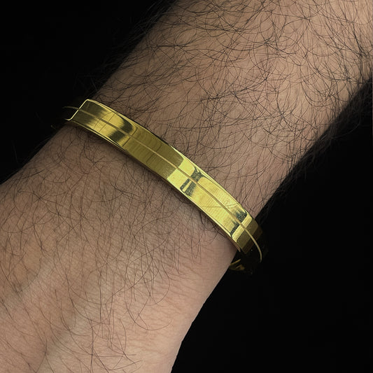 Polished Power: Grooved Gold Stainless Steel Bracelet for Men